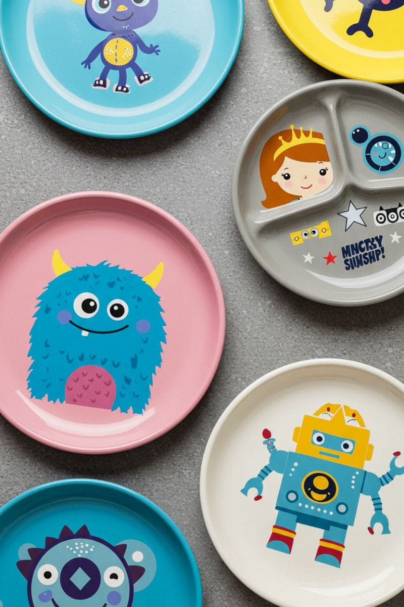 Colorful cartoon-themed bamboo melamine plates for kids with monster and robot prints